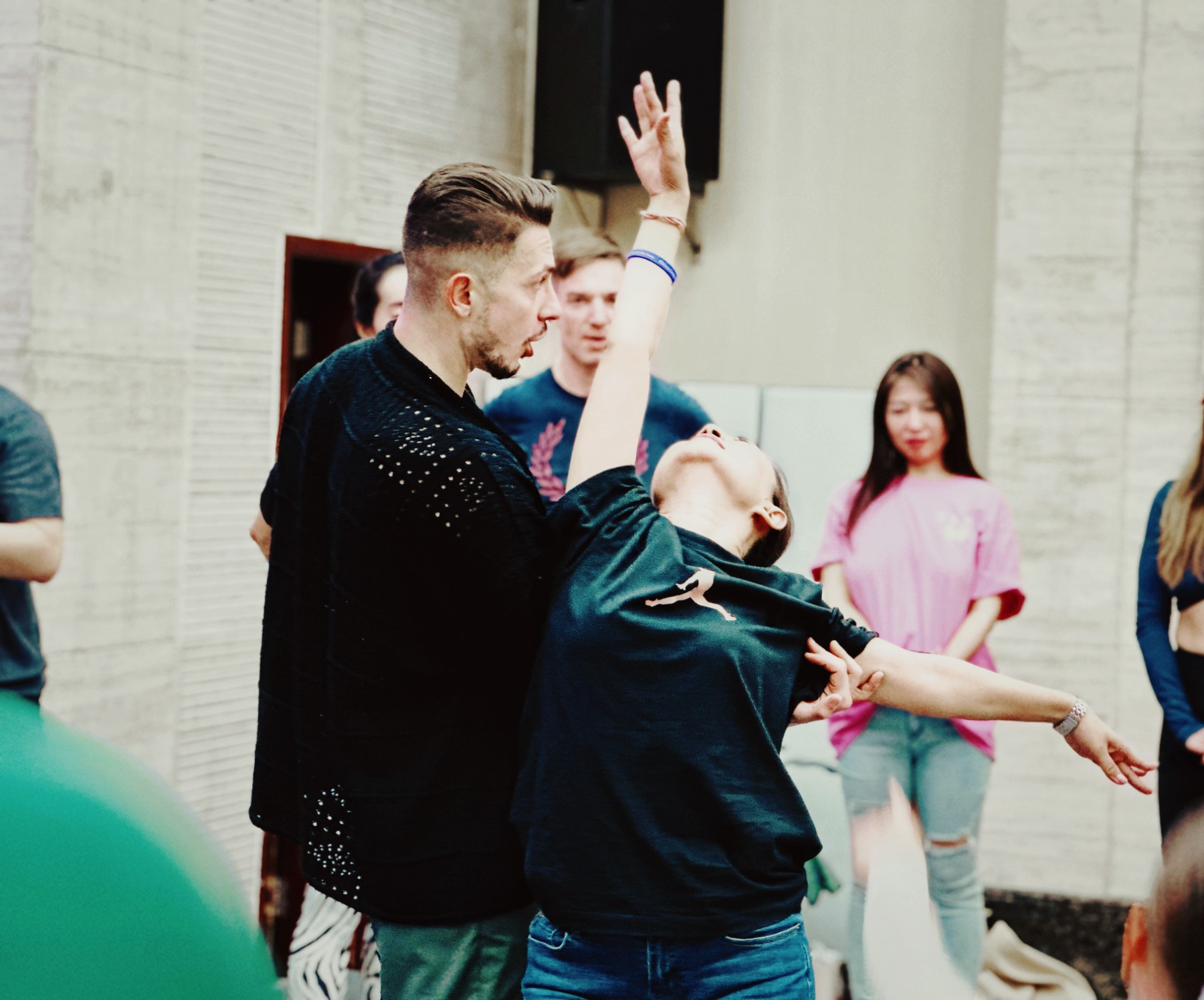 Michael guiding a student into a backbend