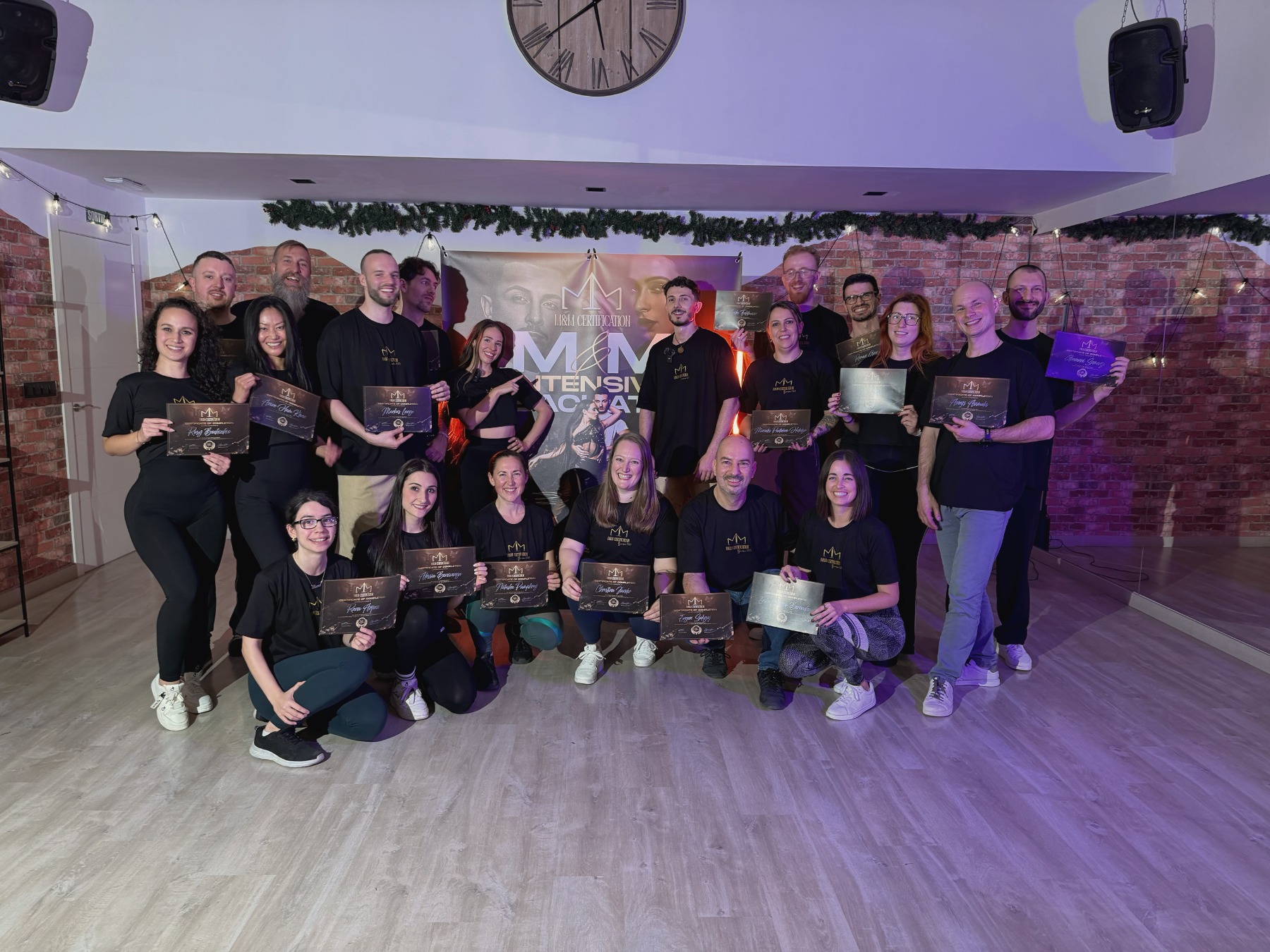 Participants holding their M&M certificates